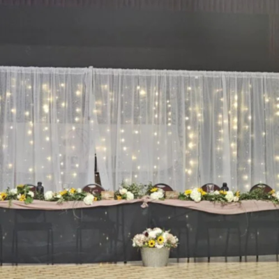 back-drop.png Backdrop with white drapes and fairy lights - 10-24 ft wide